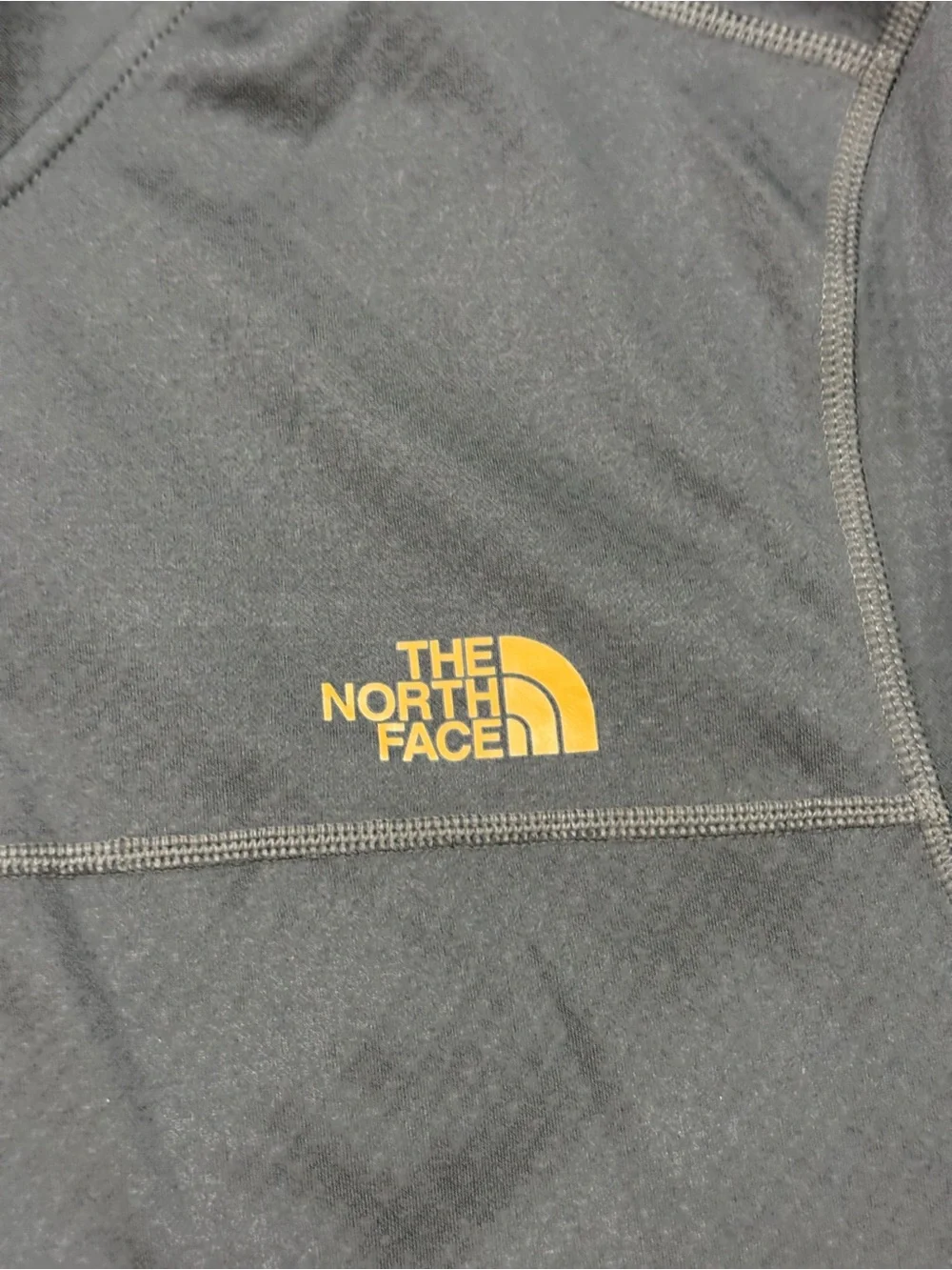 The North Face Black Half-Zip Performance Top with Gold Logo